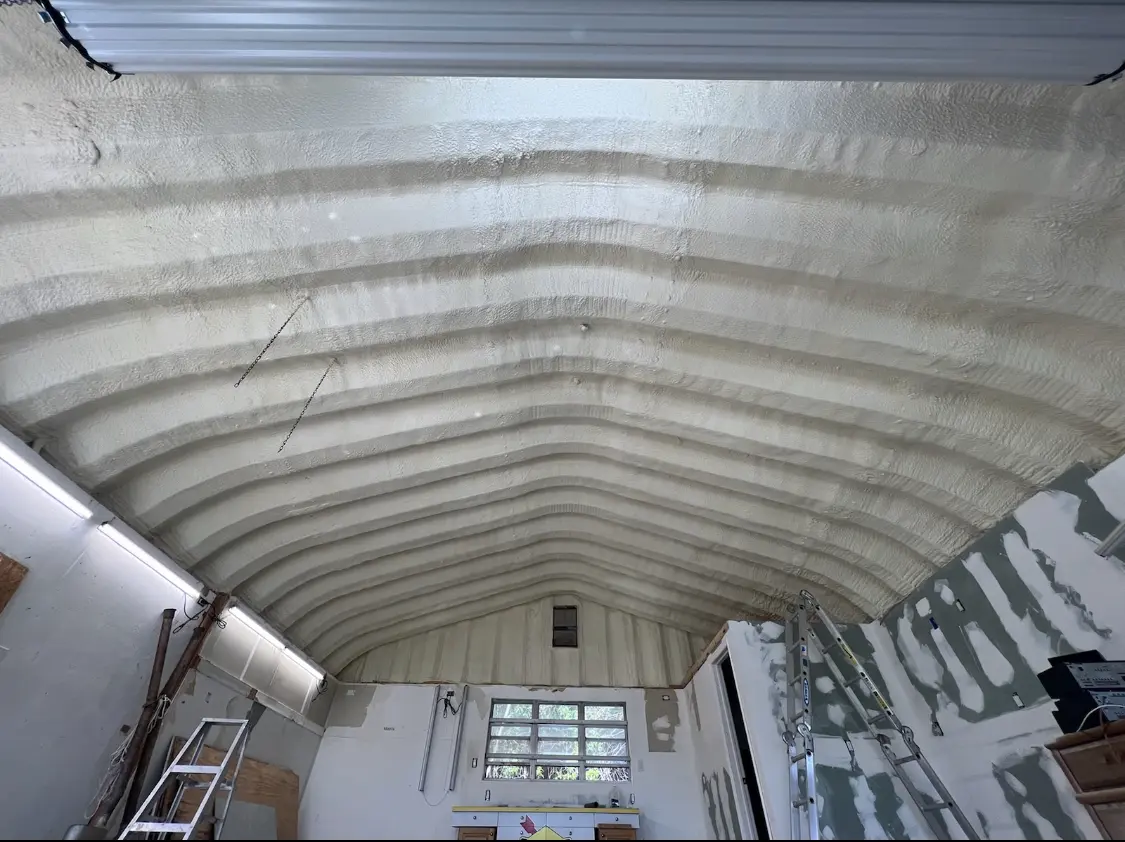 Spray polyurethane foam applied to the underside of a metal roof deck in Craig